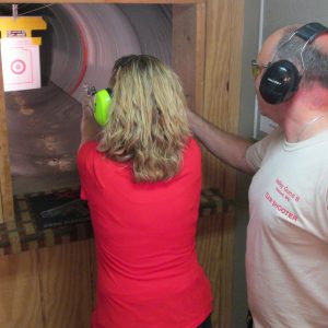Instructor providing fundamentals of handgun training